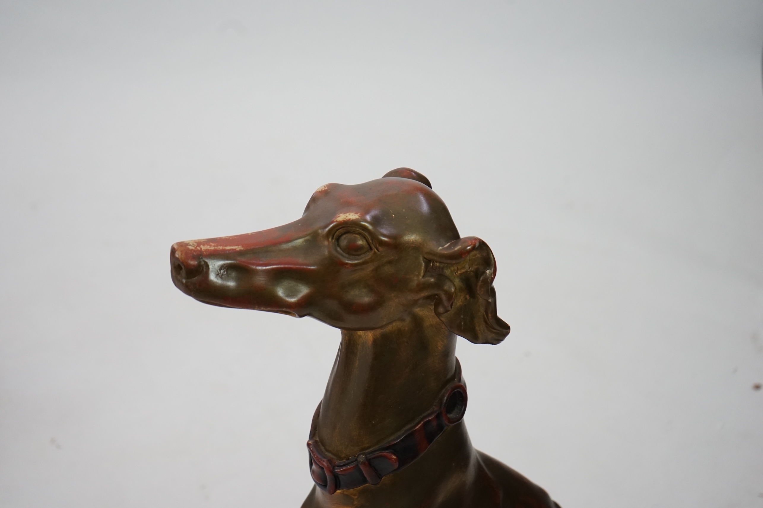 A 20th century Italian gilt and painted model of a seated Greyhound